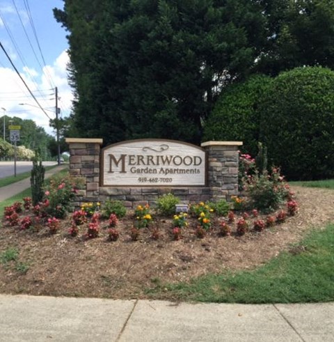 a sign for the merrwood garden appointment on the side of a street