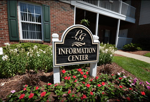 A sign that says "LG Information Center" in front of a building.