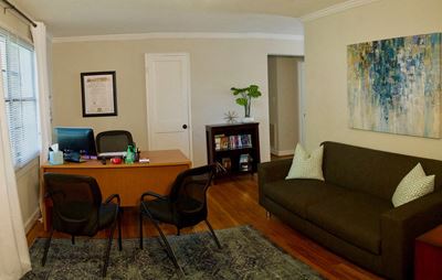 Leasing office with desk and sofa