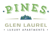 The logo for Pines at Glen Laurel Luxury Apartments with a white background.