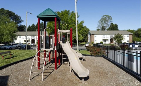 a childrens playground with a slide