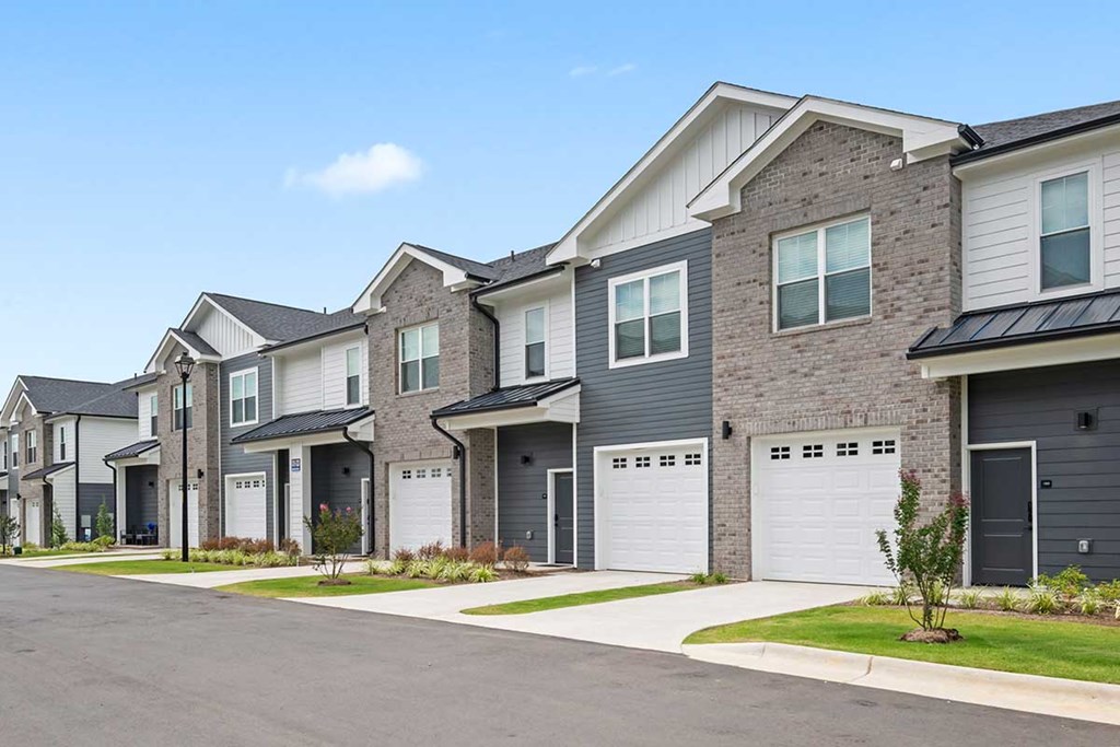 A row of modern houses with garages.