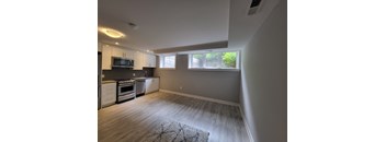 A kitchen with a microwave, oven, and dishwasher.