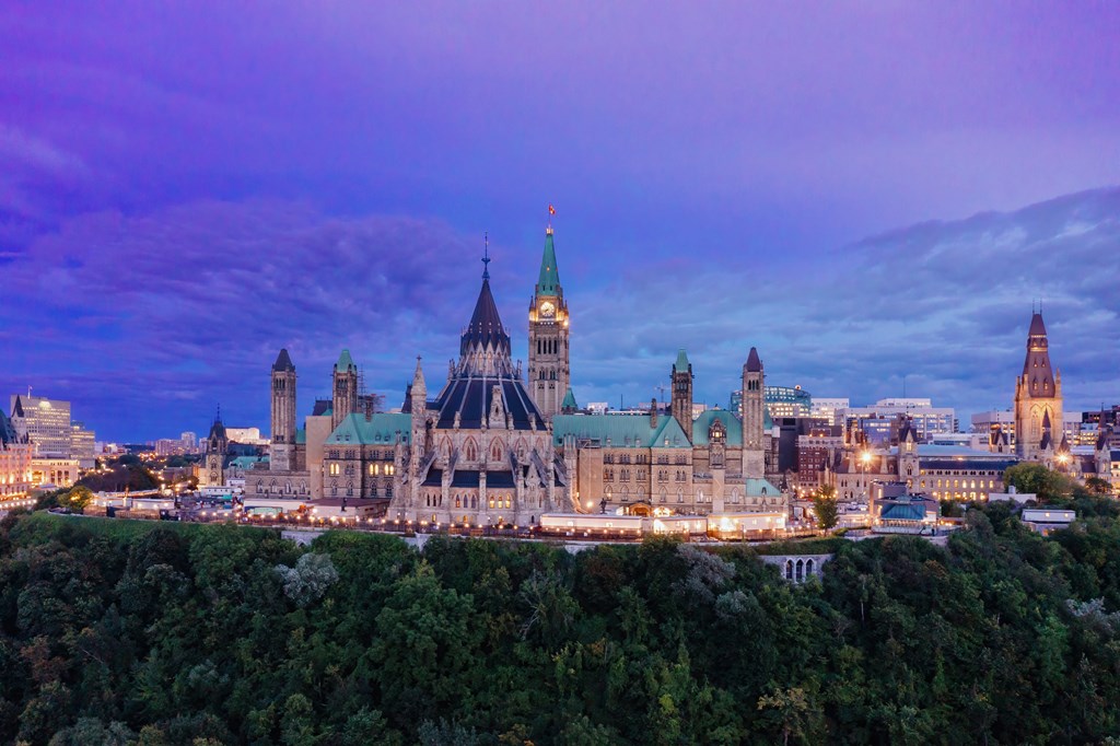 A large, ornate building with a green roof is the focal point of the image.