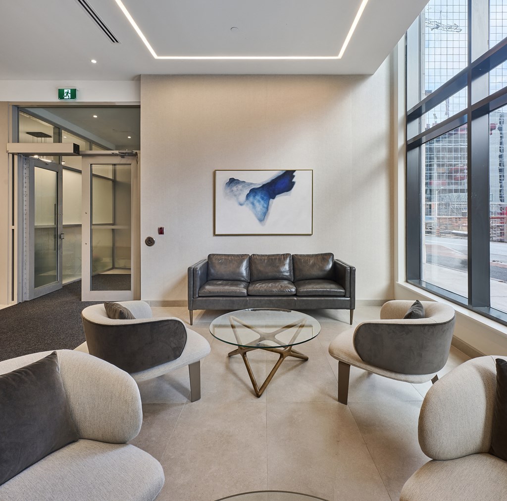 a living room with couches and chairs and a table