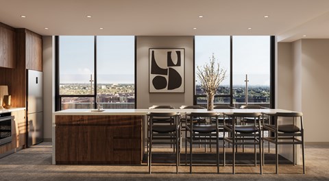 A modern kitchen with a dining table and chairs.