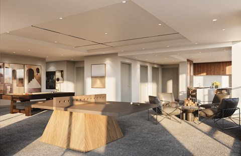 A modern living room with a large table and chairs.