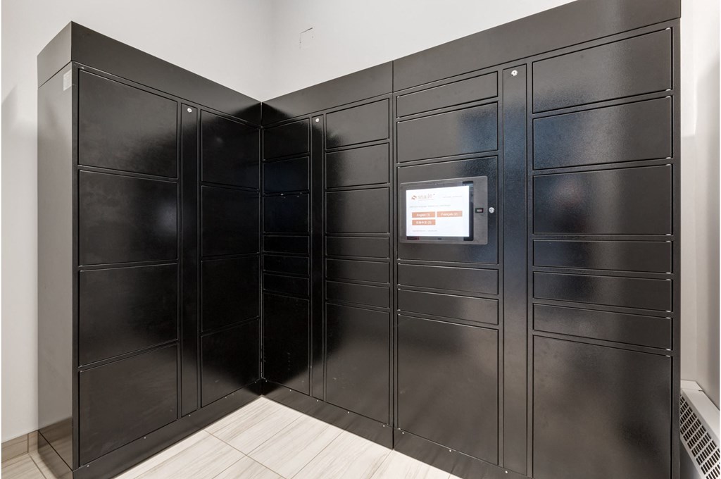 A black metal locker room with a white door.