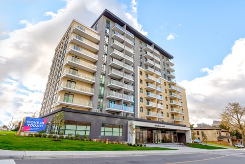 a large apartment building on the side of a street