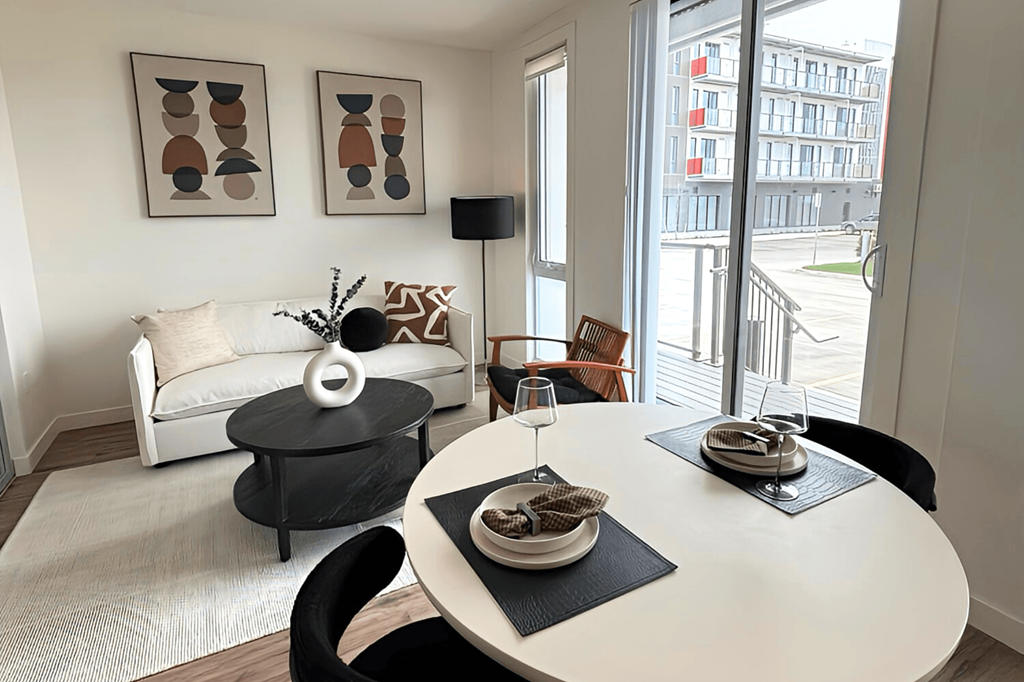 a living room with a white table and a white couch