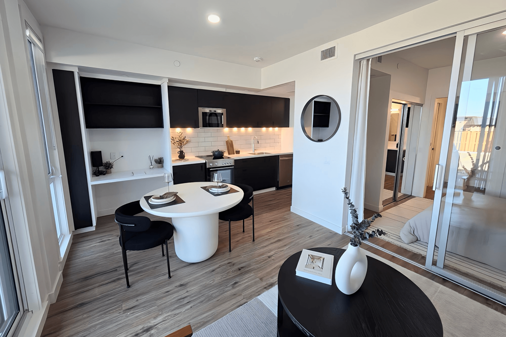 a renovated living room with a dining room and a kitchen