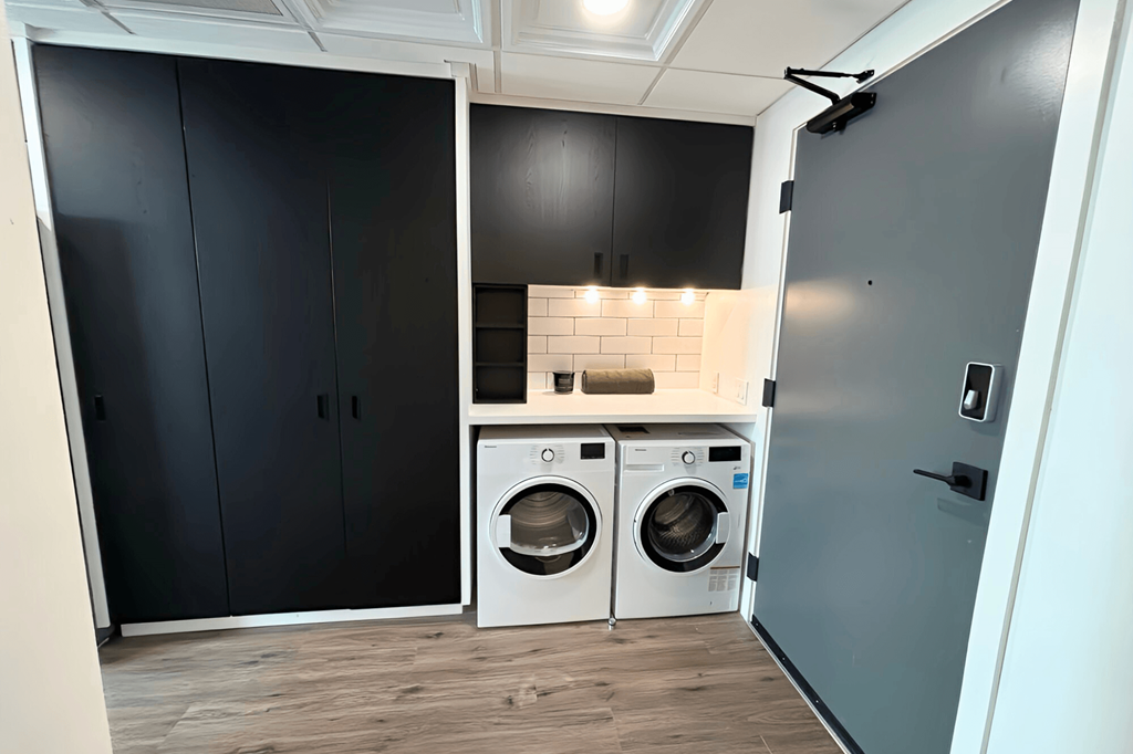 a small laundry room with a washer and dryer in it