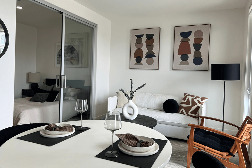 a living room with a white table and a white couch