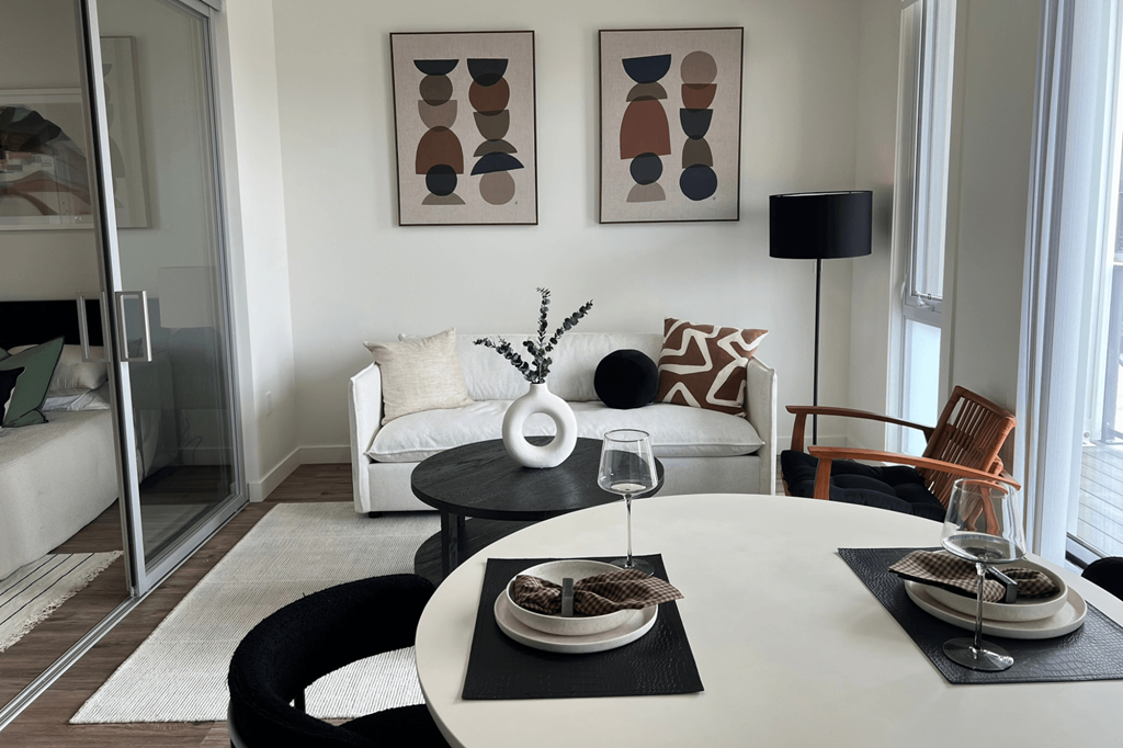 a living room with a white table and a white couch