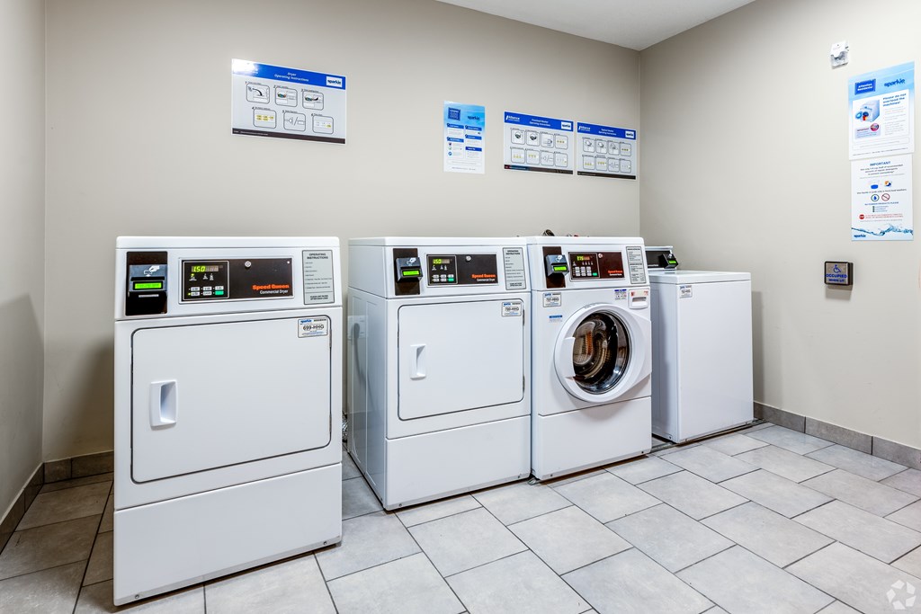 A row of washing machines in a laundromat.