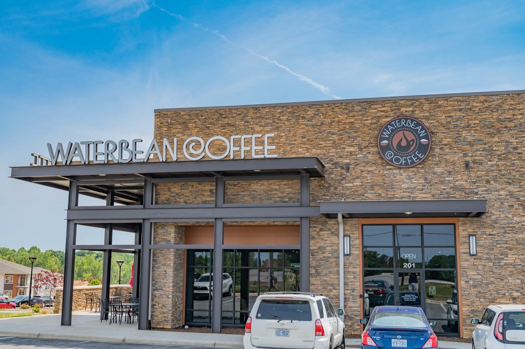 the exterior of a water bean coffee shop with cars parked in front of it at Preston Ridge, Hickory North Carolina