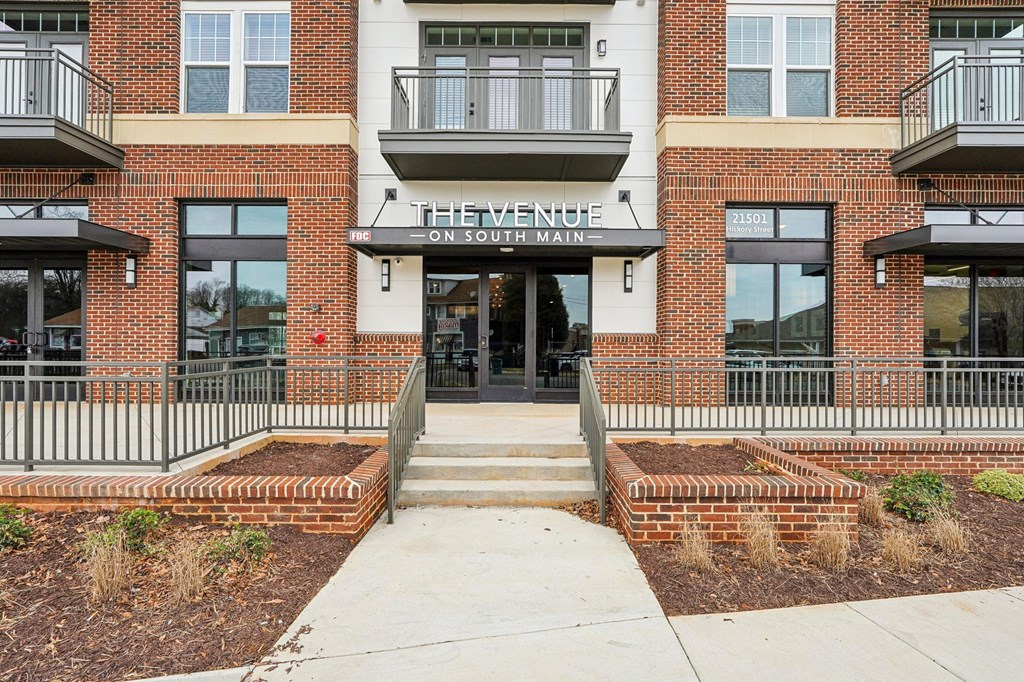 The entrance to a building with a sign that reads "The Venue on South Main.".