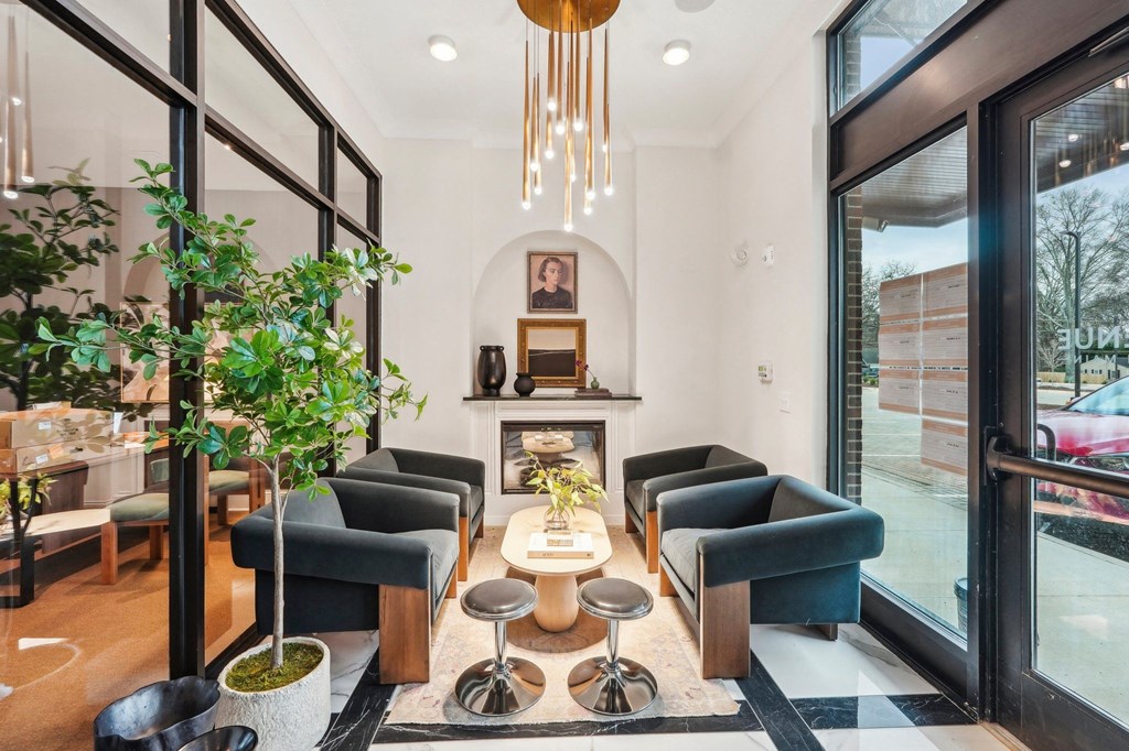 A modern living room with a fireplace and comfortable seating.