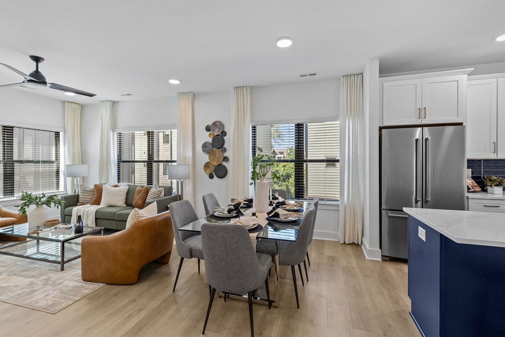a living room with a kitchen and a dining table at The Collection Charlotte in Charlotte, NC, 28205