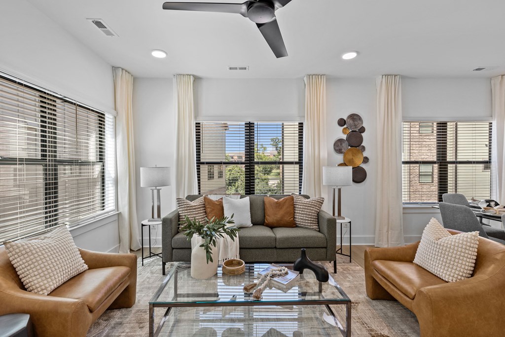 a living room with couches and a glass coffee table at The Collection Charlotte in Charlotte, NC, 28205