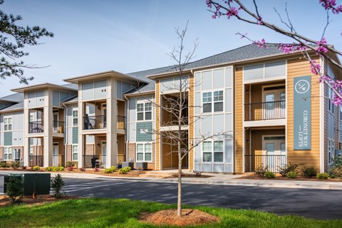 an apartment building with a street in front of it