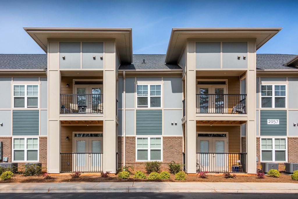 an apartment building on the side of a street