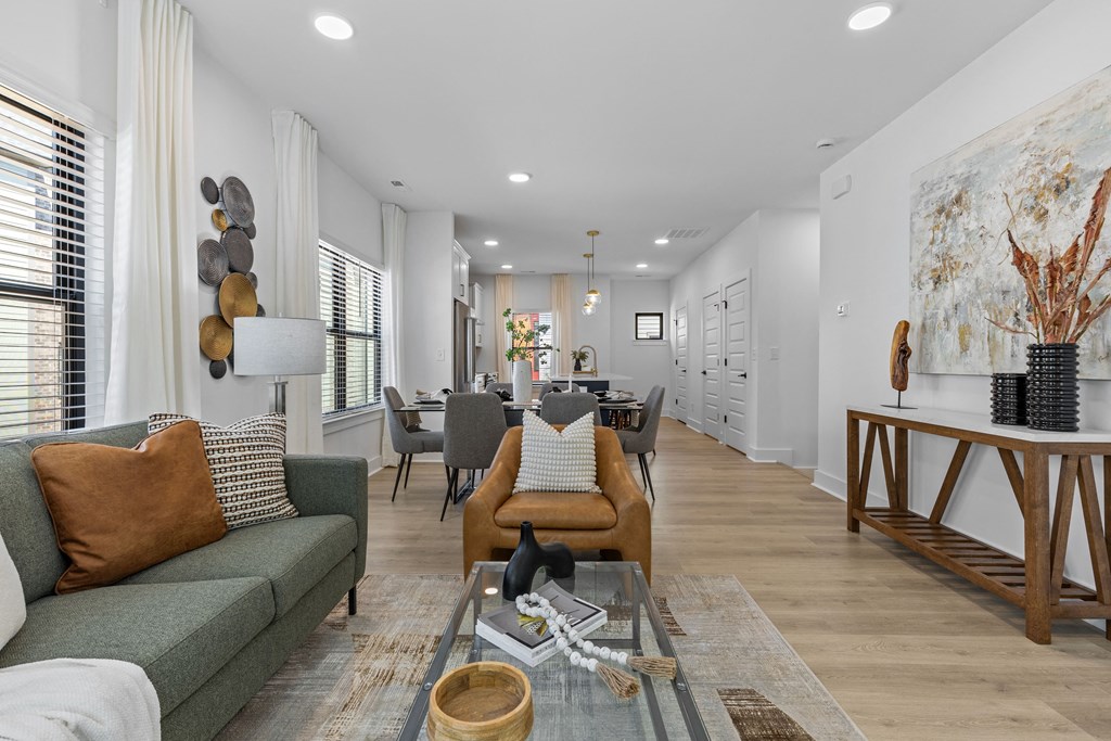 a living room with couches and chairs and a table at The Collection Charlotte in Charlotte, NC, 28205