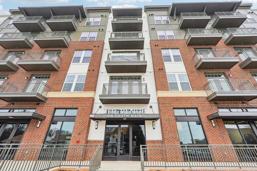 The Venue on South Main is a multi-story apartment building with balconies on each floor.