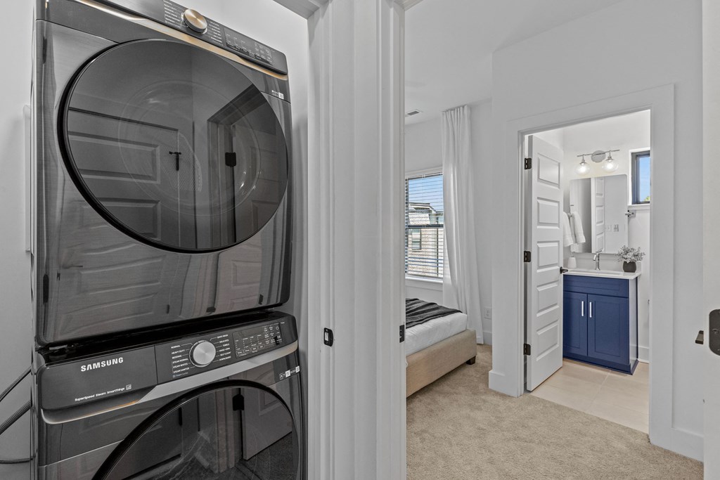 a washer and dryer in a room with a bathroom and a bedroom at The Collection Charlotte in Charlotte, NC, 28205