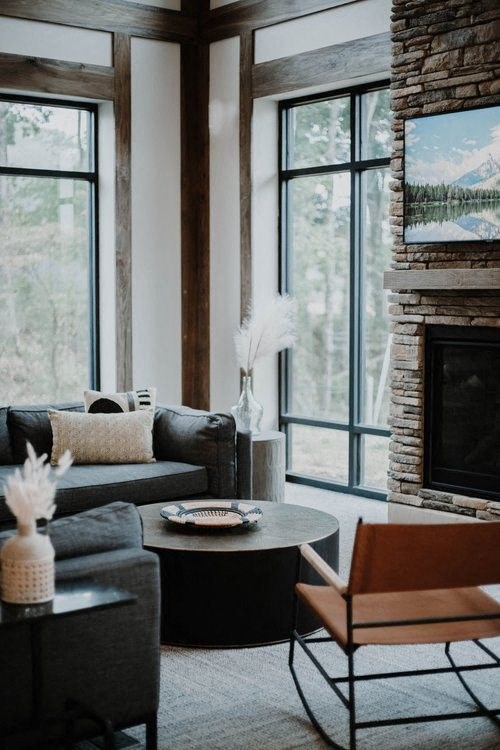 a living room filled with furniture and a fireplace