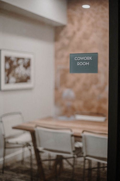 a conference room with a table and chairs