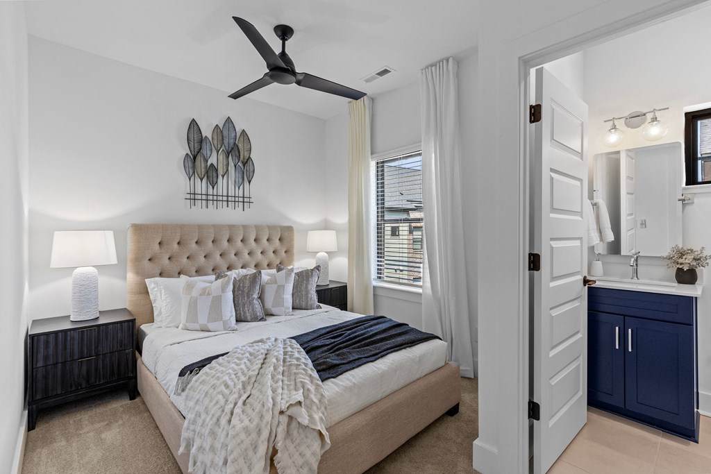 a bedroom with a bed and a ceiling fan at The Collection Charlotte in Charlotte, NC, 28205