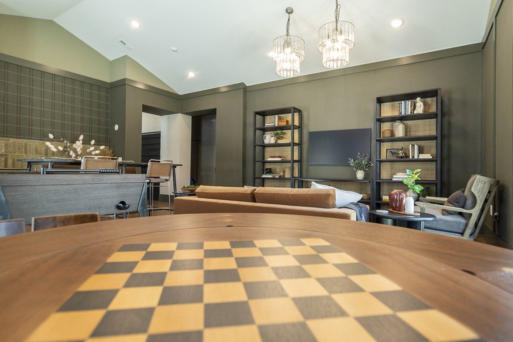 a large table with a chessboard in the middle of it at Landon Green Artisan Cottages Apartments, Hickory, North Carolina