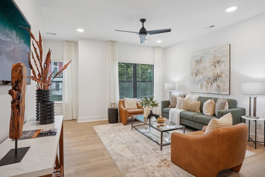 a living room with a couch and a coffee table at The Collection Charlotte in Charlotte, NC, 28205
