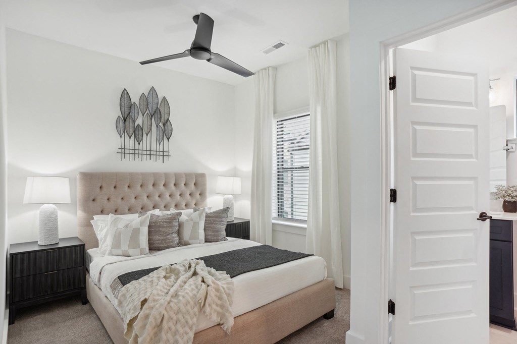 a bedroom with a bed and a ceiling fan at The Collection Charlotte in Charlotte, NC, 28205