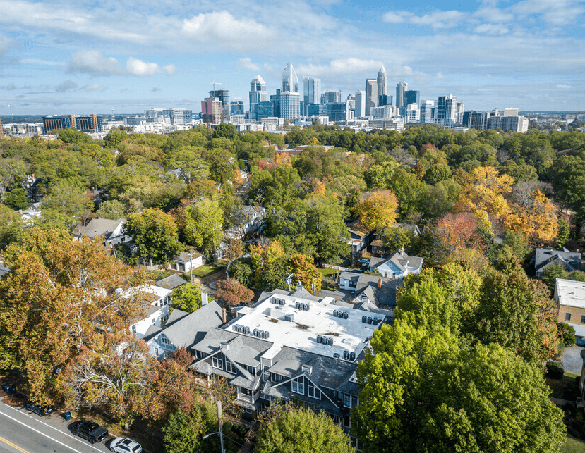 A view of a city skyline from a residential area.