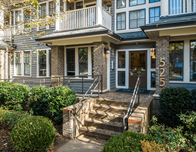 A house numbered 525 with a front porch and steps leading up to the entrance.