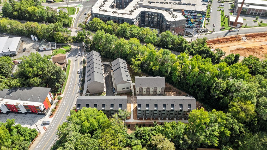 an aerial view of a city with buildings and trees at The Collection Charlotte in Charlotte, NC, 28205