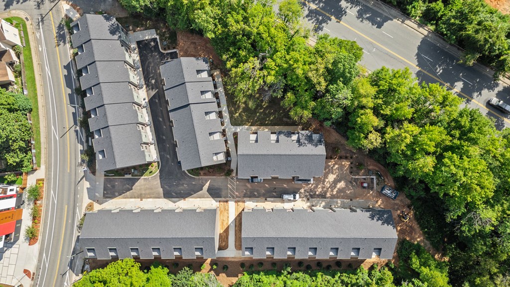 an aerial view of a building with a street and trees at The Collection Charlotte in Charlotte, NC, 28205