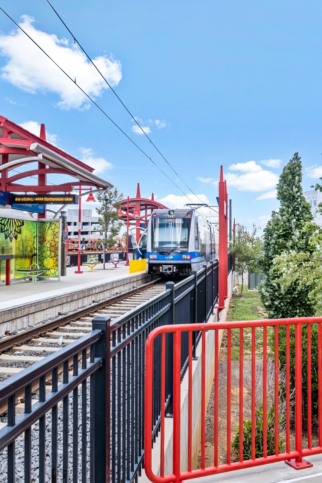 a train pulling into a train station at The Collection Charlotte in Charlotte, NC, 28205