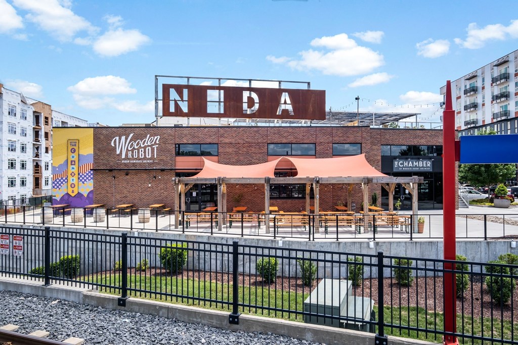 building with a large mural on the side of it at The Collection Charlotte in Charlotte, NC, 28205