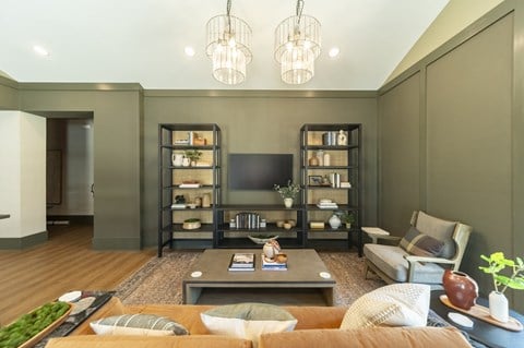 a living room filled with furniture and a flat screen tv at Landon Green Artisan Cottages Apartments, Hickory, 28601