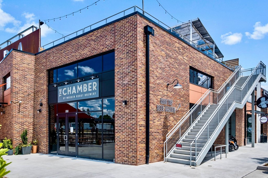 the front of a brick building with a staircase at The Collection Charlotte in Charlotte, NC, 28205