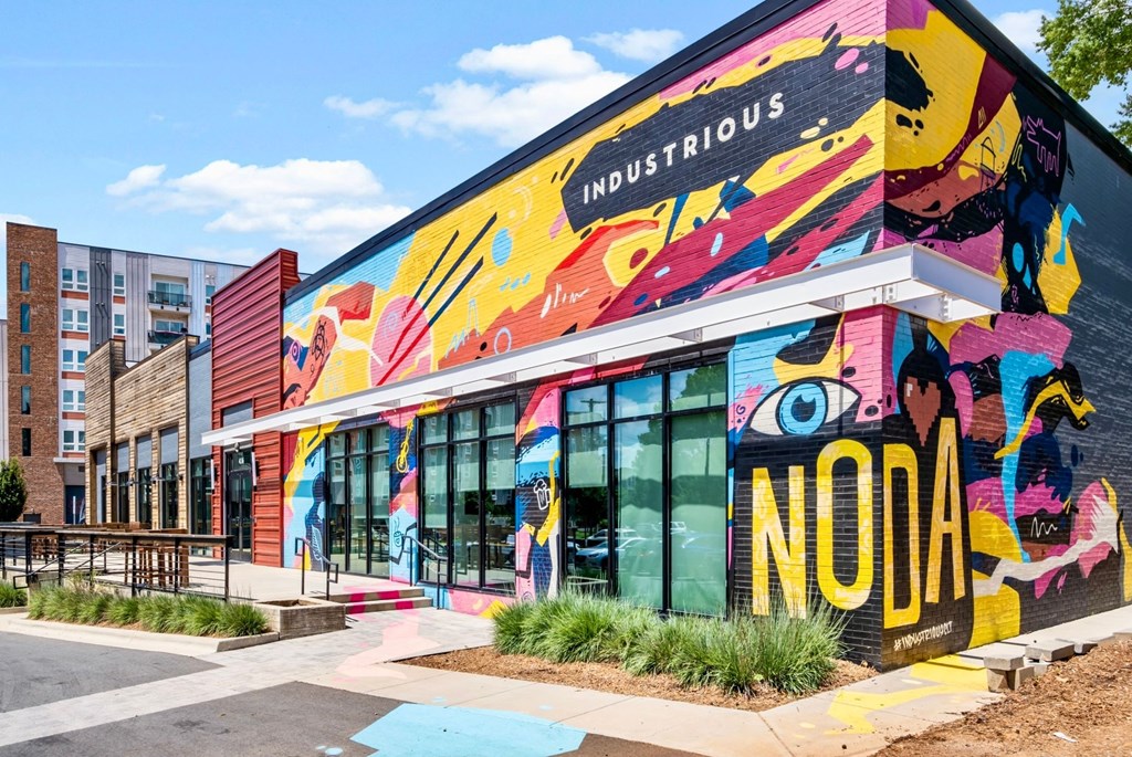 a colorful mural on the side of a building at The Collection Charlotte in Charlotte, NC, 28205
