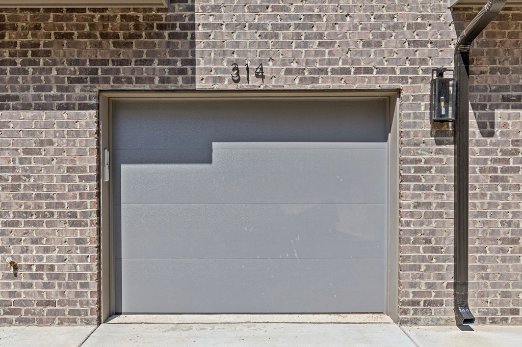 A garage door is closed and has a number 314 above it.