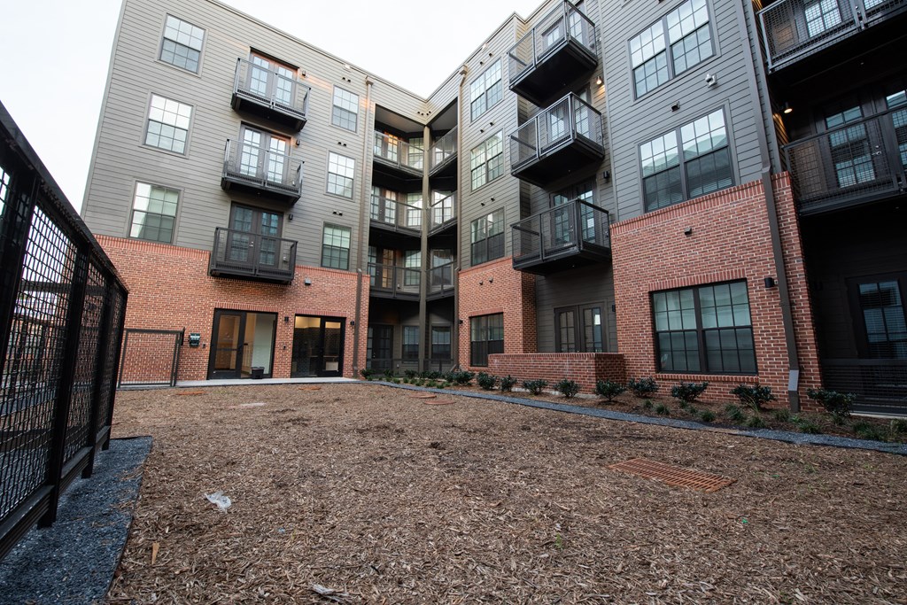 an empty lot in front of an apartment building