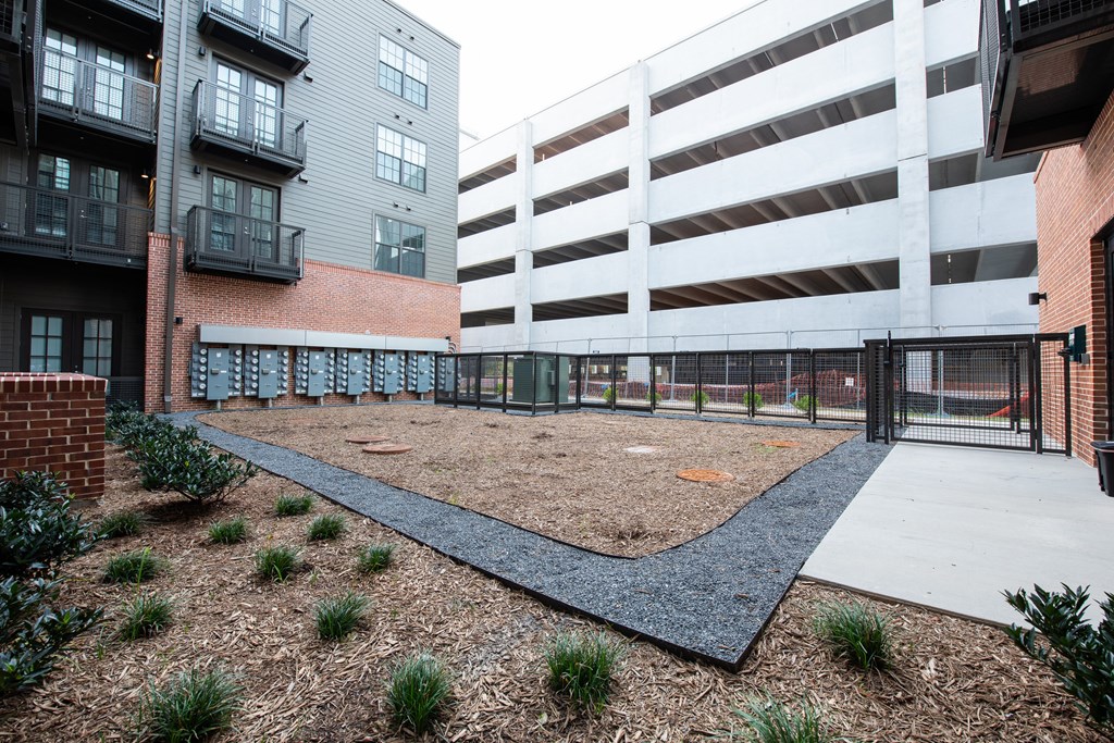 an empty playground in front of an apartment building