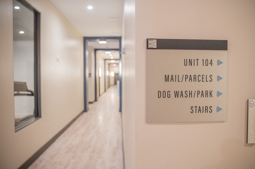 a hallway with a sign that reads unit toaaahidates dog wash park stars