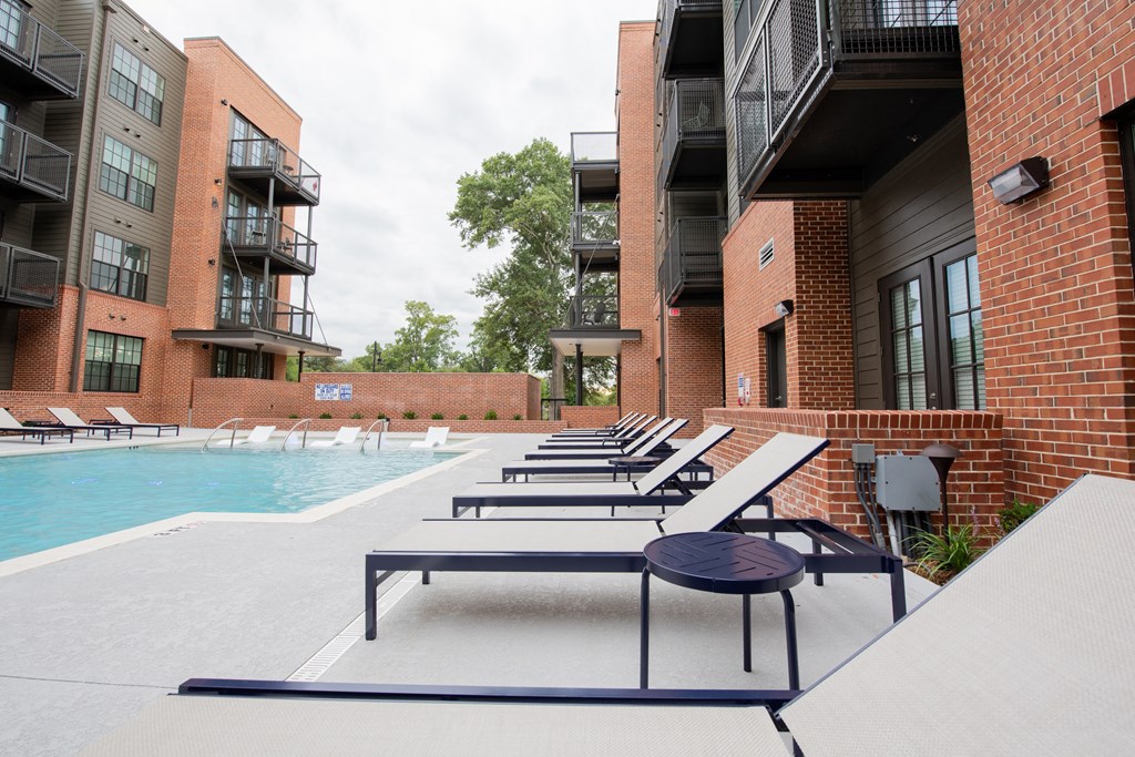 our apartments have a large pool and lounge chairs