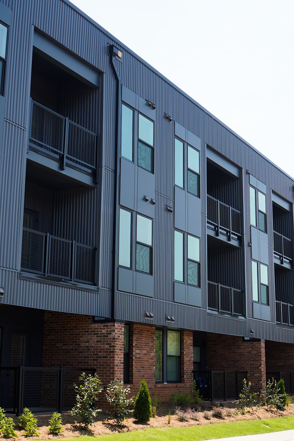 A modern building with balconies and windows.